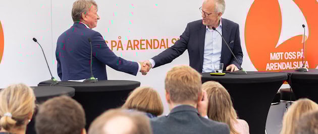 a man shaking hands with a man