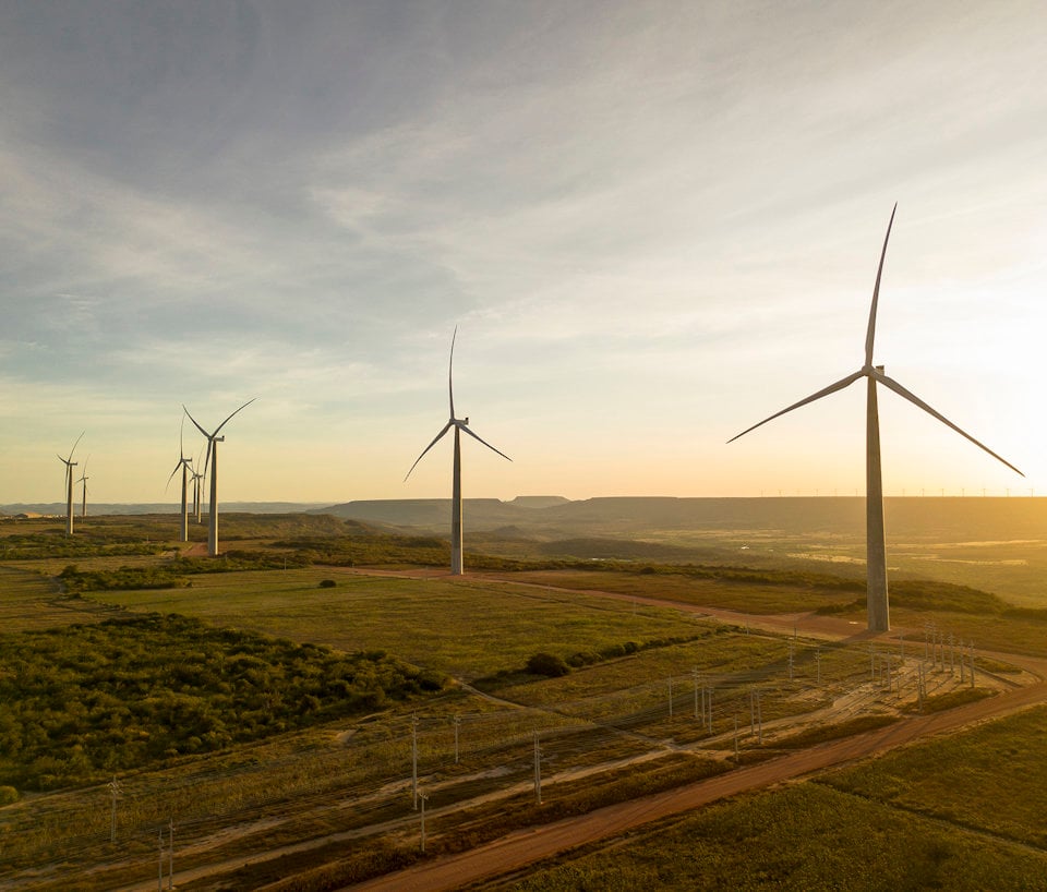 a group of wind turbines in a field