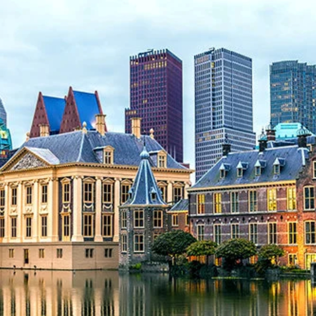 a city with buildings and a body of water